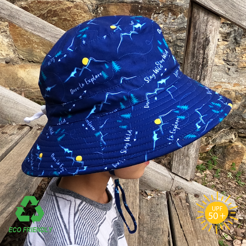 Side view of an adventure pattern recycled rPet fabric kids bucket sun hat for toddlers with a wide brim for excellent sun protection