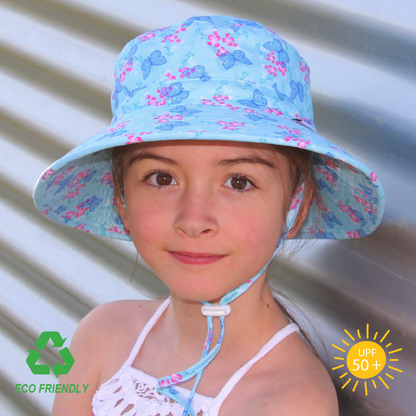 Eco-friendly kids bucket hat with cheerful butterfly garden print, wide brim for UPF 50+ sun protection, and soft recycled rPET fabric with safety-release strap.