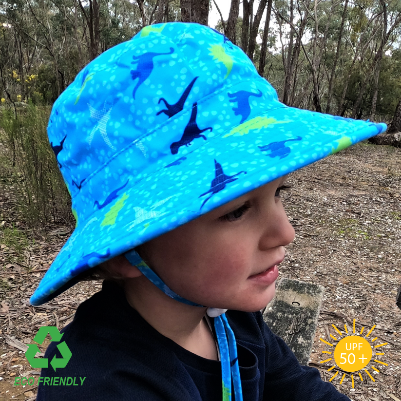 Side view of Kids bucket sun hat with fun dinosaur print, wide anti-flop brim, breakaway chin strap, and breathable recycled rPET fabric for sun-safe adventures
